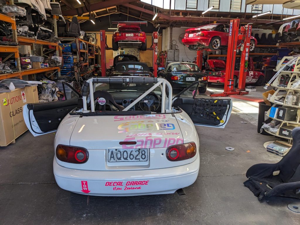 #43 MX5 with Garage 5 workshop in the background